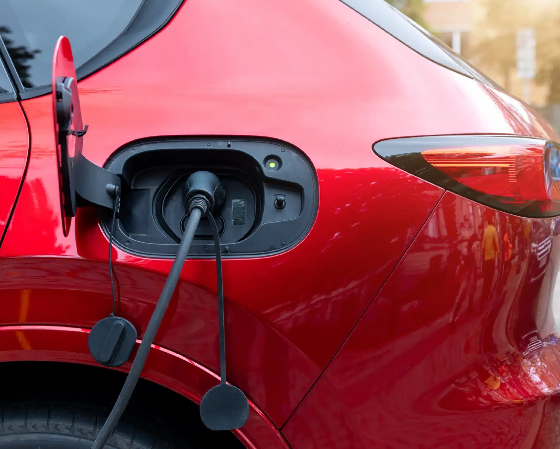 EV and Hybrid auto repair in New Braunfels, TX by Clark's Auto Service. Image of an electric vehicle charging port, highlighting advanced diagnostics, battery service, and reliable maintenance for hybrid and electric vehicles.